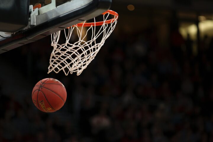 Basketball leaving basketball net